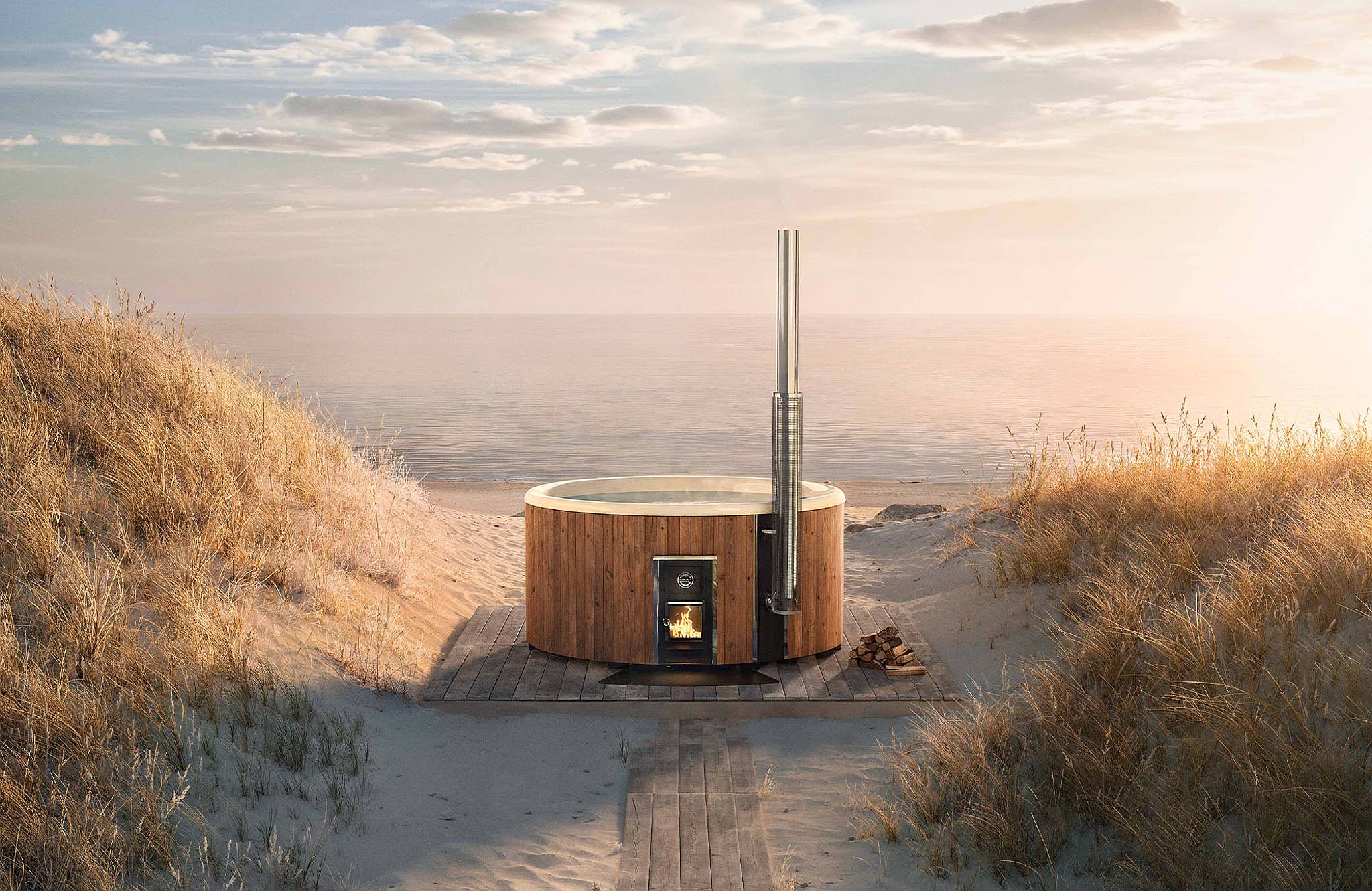 A wooden hot tub with a tall flue guard on a hill overlooking the ocean.