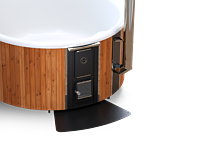 Modern bathroom with a white oval bathtub and wooden exterior on a wooden base.