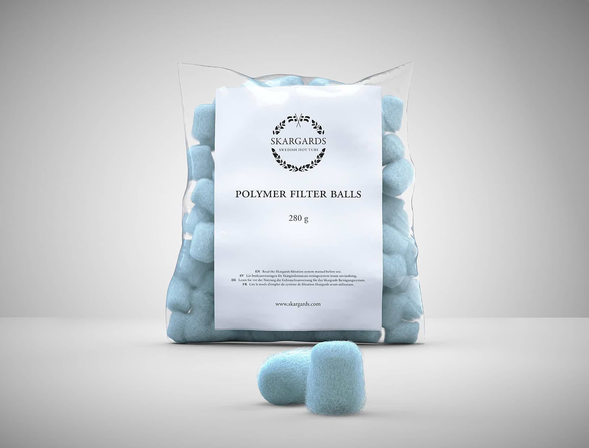 A bag of blue filter balls for Skargards hot tubs on a white surface.
