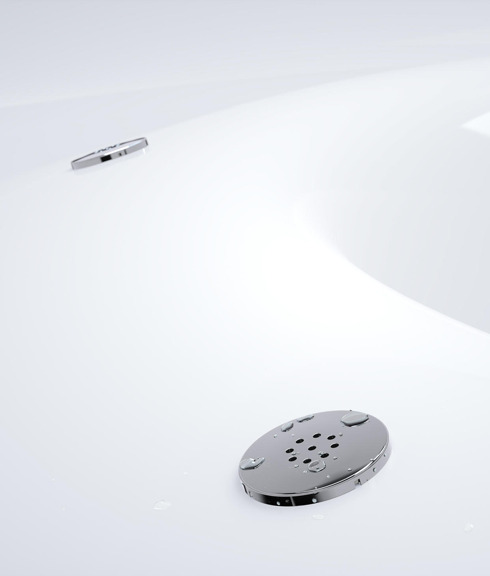 Close up of three bubble system jets mounted in the tub of a wood-fired hot tub