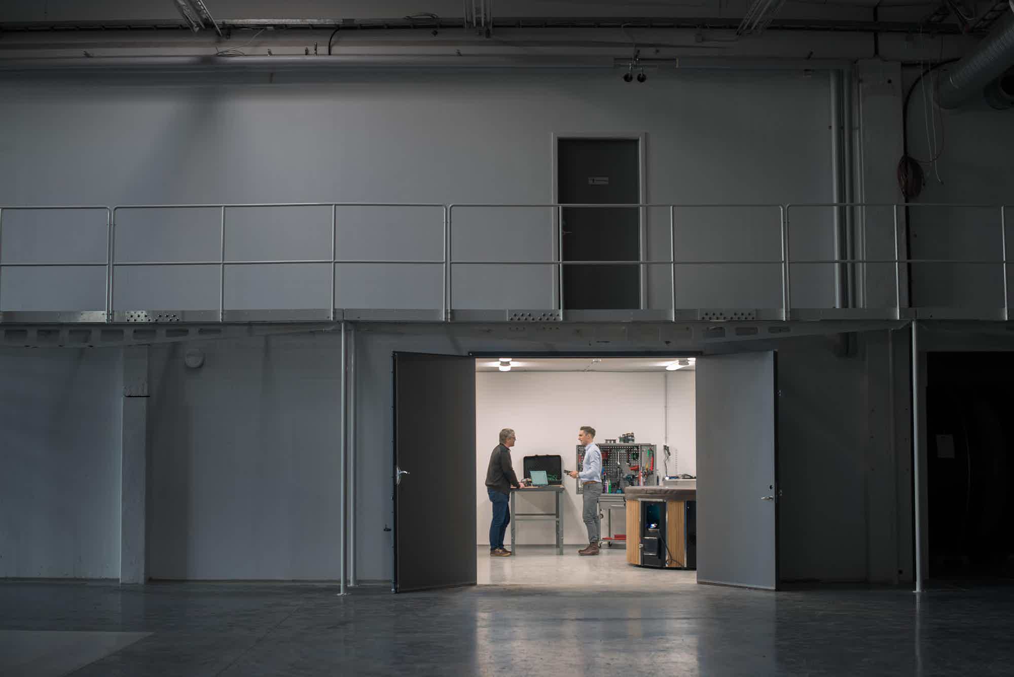 A modern workspace with two men in the innovation process.