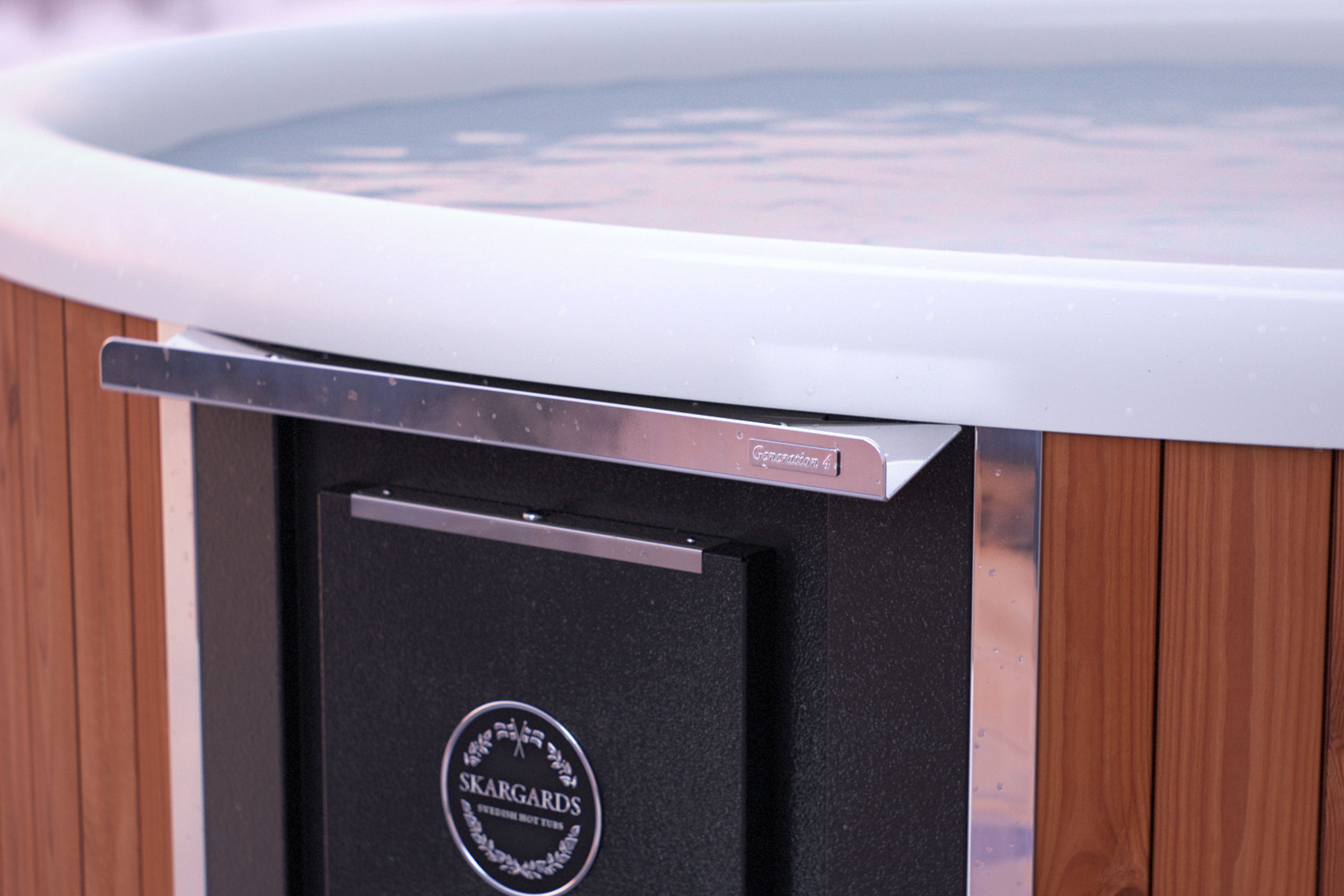 Modern hot tub with curved edge and silver handle on wooden cabinet.