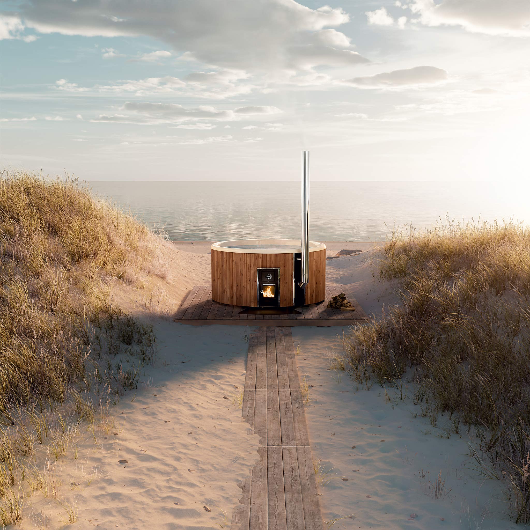 Wood-fired Skargards Regal Standard hot tub on a beach with tall grasses, stove fired up, clear sky.