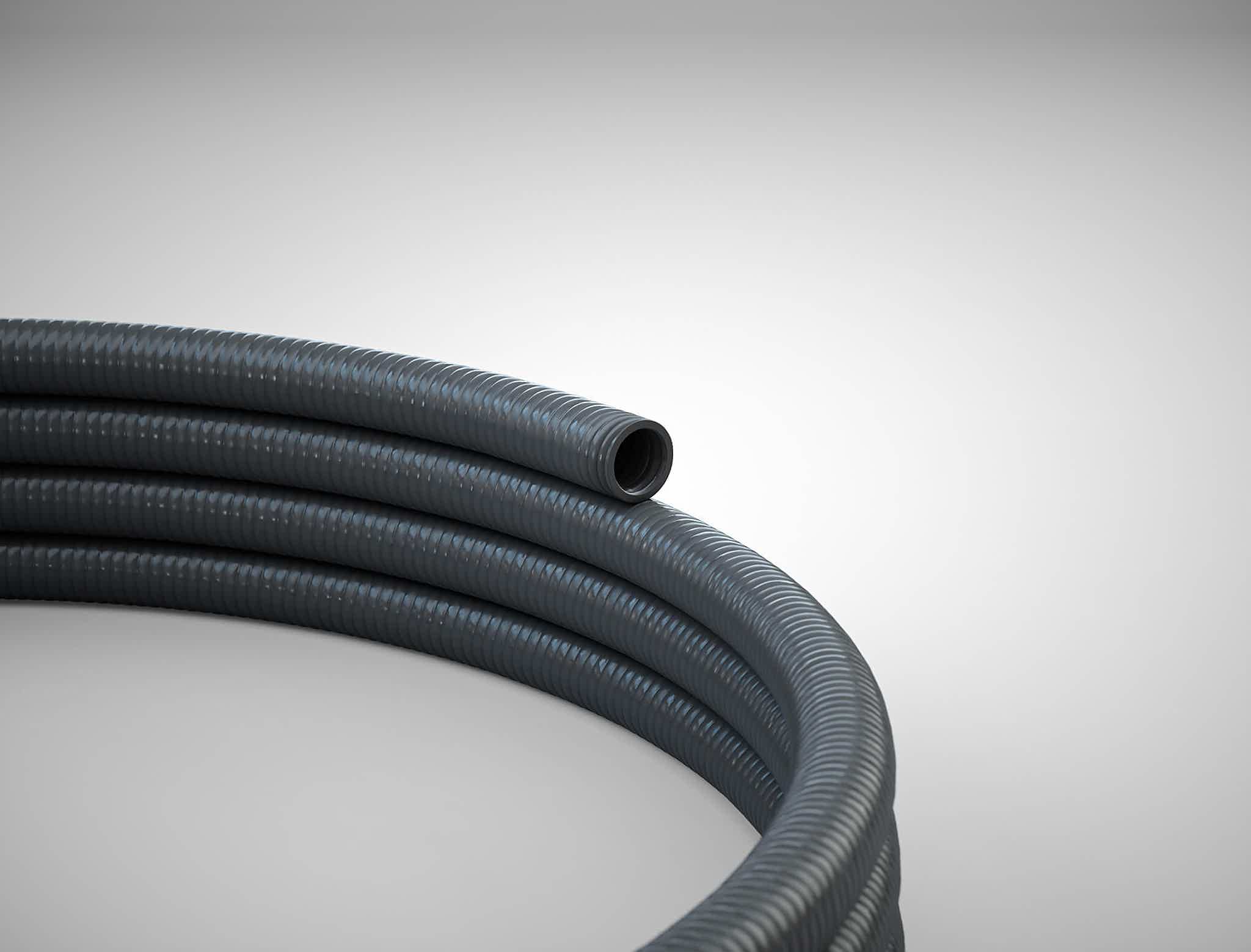 Close-up of a black hose on white background.