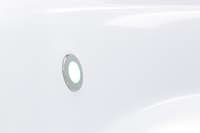 A white surface with a circular light fixture.