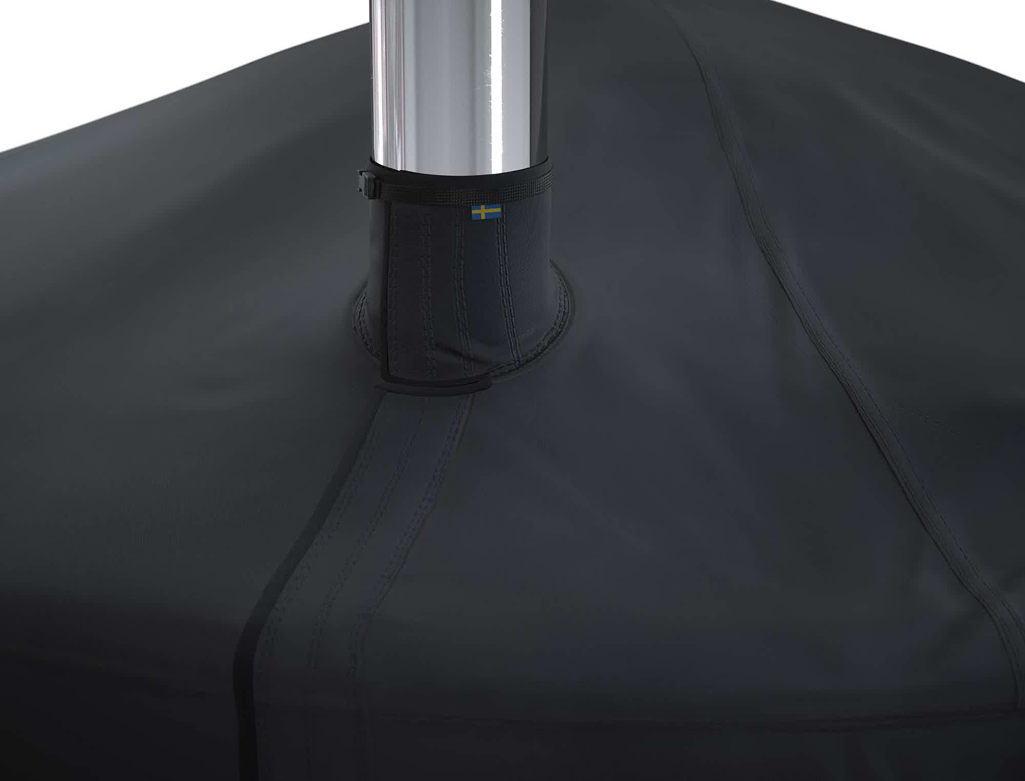 Black canvas cover for Skargards hot tub with silver pole.
